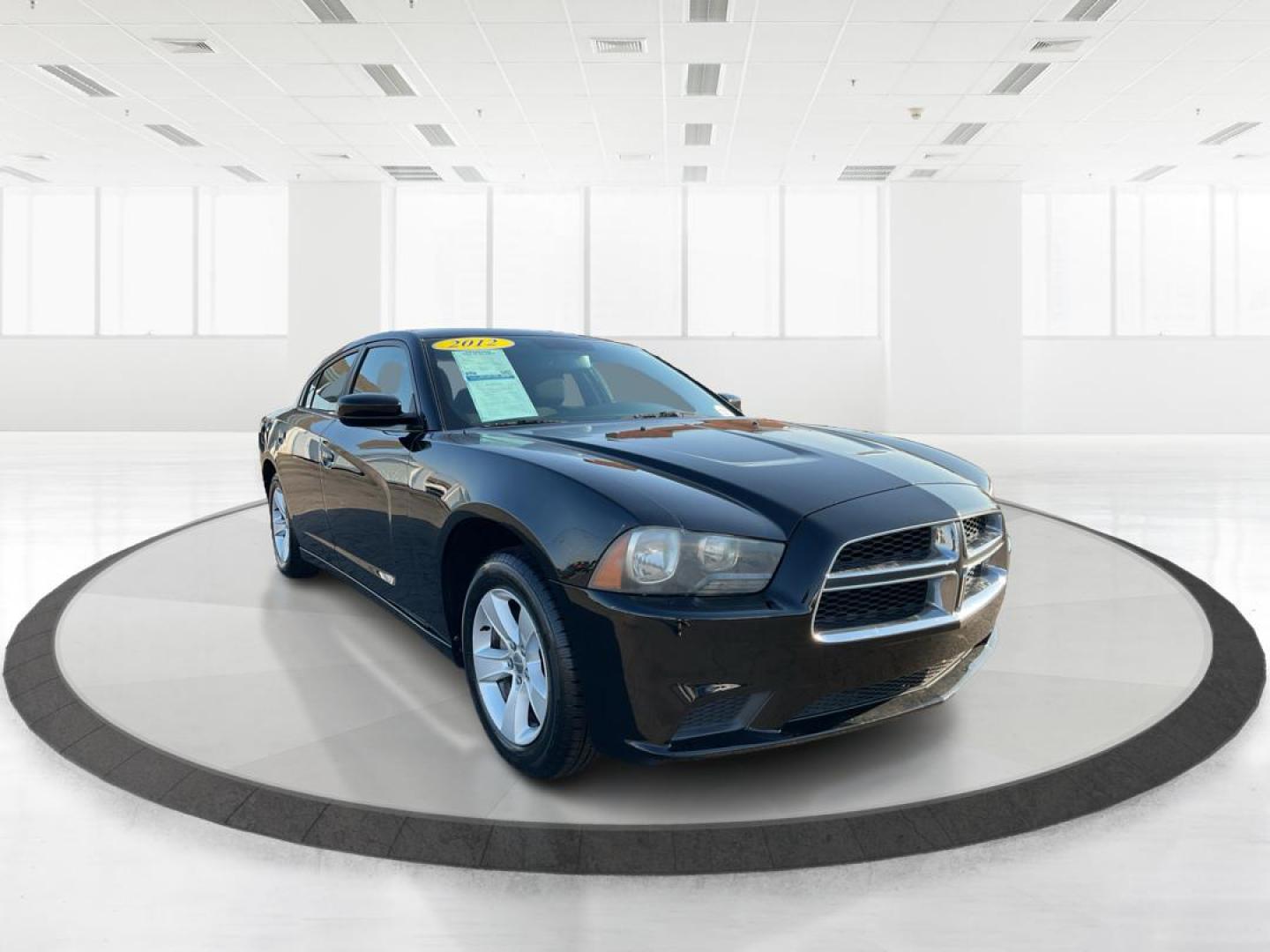 2012 Pitch Black Dodge Charger SE (2C3CDXBGXCH) with an 3.6L V6 DOHC 24V engine, 5-Speed Automatic transmission, located at 401 Woodman Dr, Riverside, OH, 45431, (937) 908-9800, 39.760899, -84.123421 - Photo#0