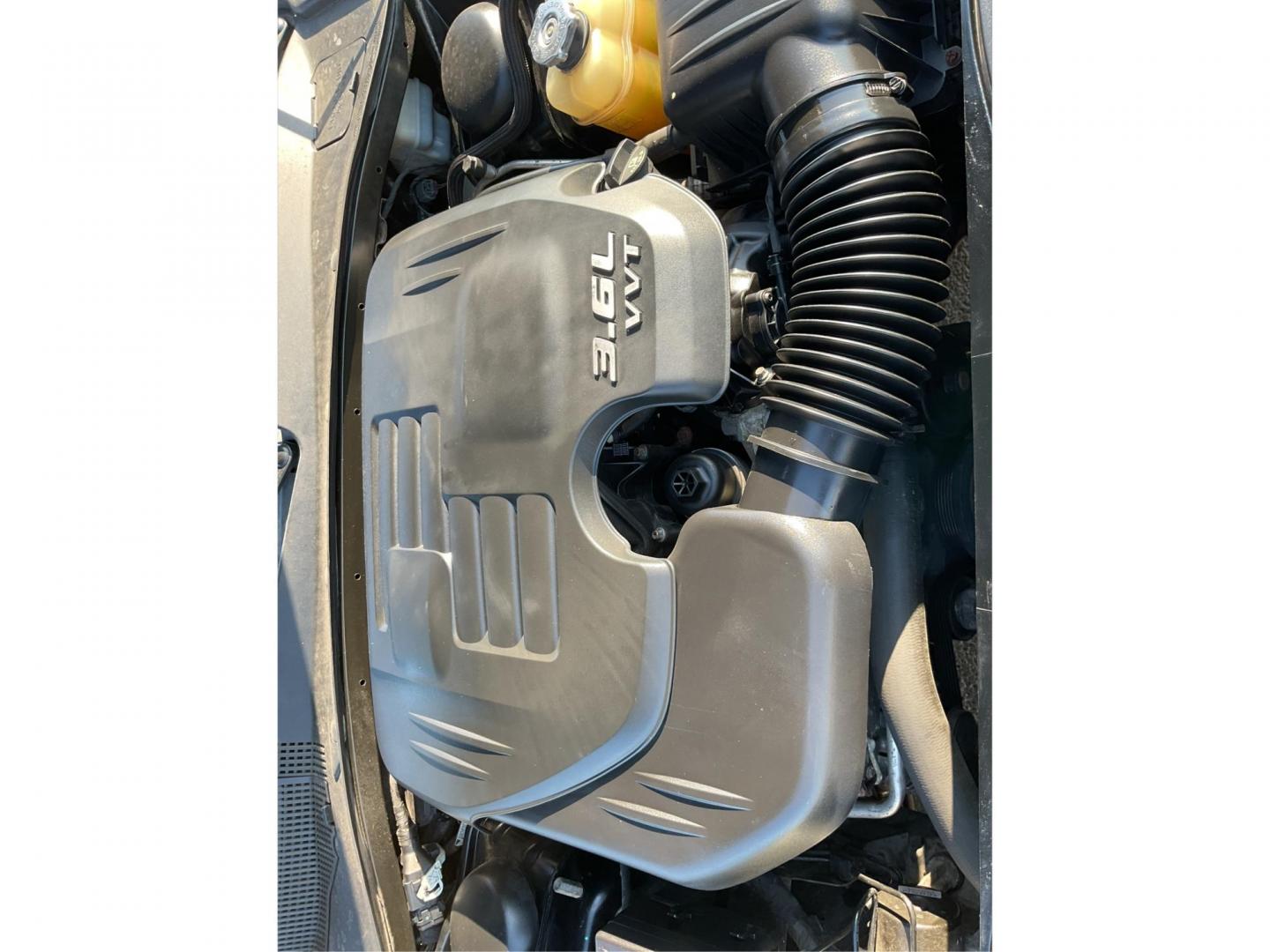 2012 Pitch Black Dodge Charger SE (2C3CDXBGXCH) with an 3.6L V6 DOHC 24V engine, 5-Speed Automatic transmission, located at 401 Woodman Dr, Riverside, OH, 45431, (937) 908-9800, 39.760899, -84.123421 - Photo#10