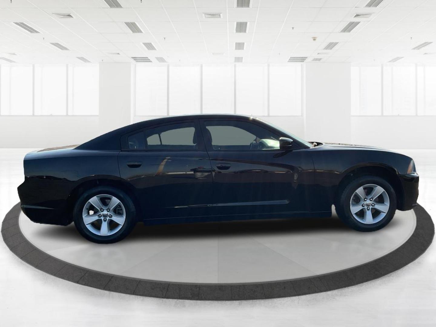 2012 Pitch Black Dodge Charger SE (2C3CDXBGXCH) with an 3.6L V6 DOHC 24V engine, 5-Speed Automatic transmission, located at 401 Woodman Dr, Riverside, OH, 45431, (937) 908-9800, 39.760899, -84.123421 - Photo#1