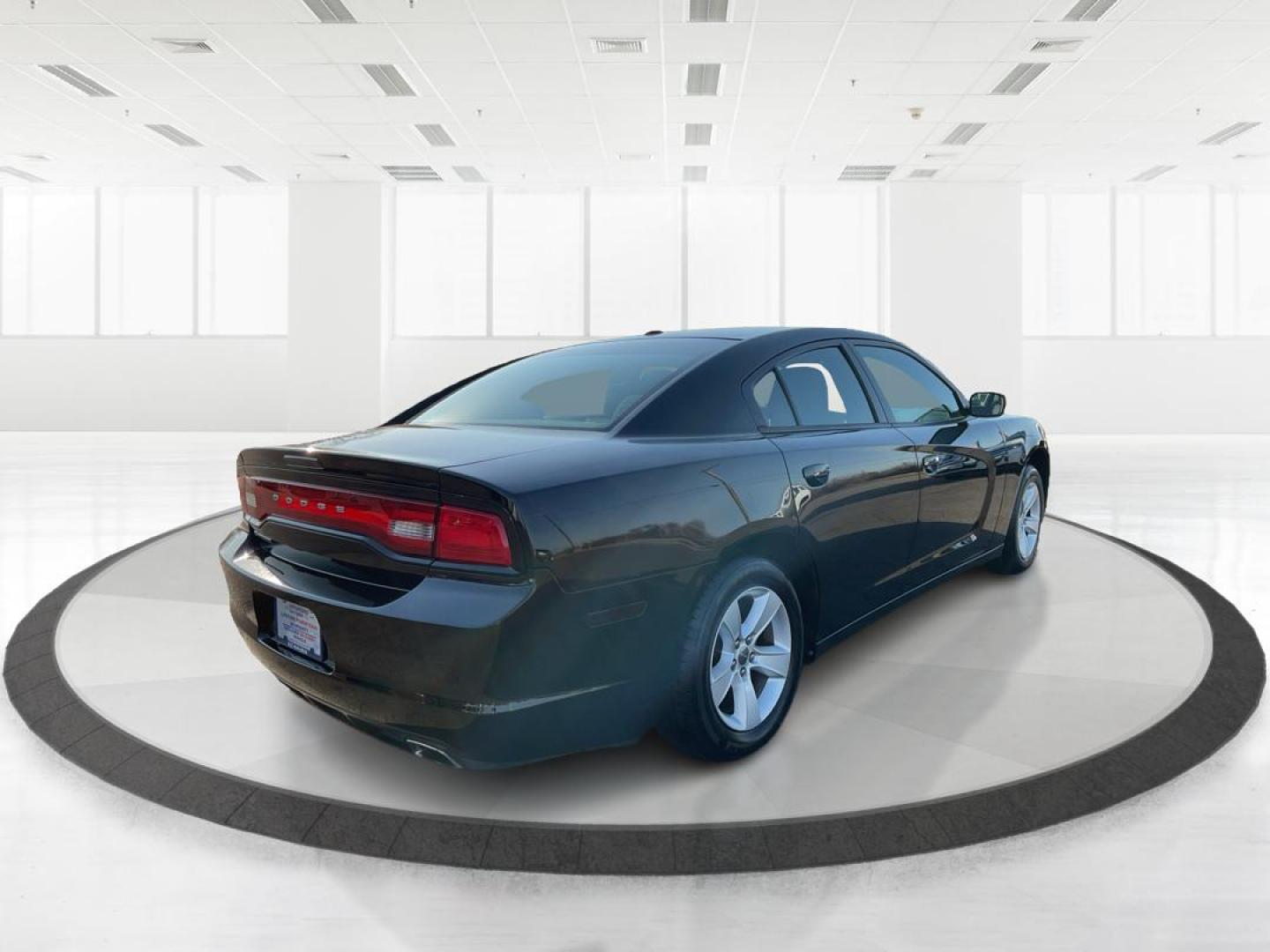 2012 Pitch Black Dodge Charger SE (2C3CDXBGXCH) with an 3.6L V6 DOHC 24V engine, 5-Speed Automatic transmission, located at 401 Woodman Dr, Riverside, OH, 45431, (937) 908-9800, 39.760899, -84.123421 - Photo#2