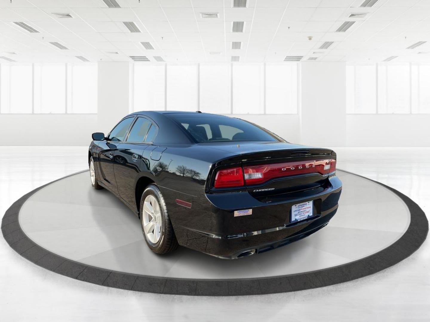2012 Pitch Black Dodge Charger SE (2C3CDXBGXCH) with an 3.6L V6 DOHC 24V engine, 5-Speed Automatic transmission, located at 401 Woodman Dr, Riverside, OH, 45431, (937) 908-9800, 39.760899, -84.123421 - Photo#4
