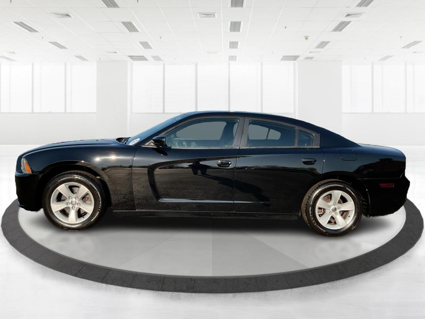2012 Pitch Black Dodge Charger SE (2C3CDXBGXCH) with an 3.6L V6 DOHC 24V engine, 5-Speed Automatic transmission, located at 401 Woodman Dr, Riverside, OH, 45431, (937) 908-9800, 39.760899, -84.123421 - Photo#5