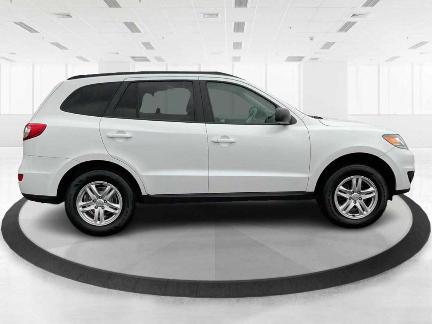 2012 Hyundai Santa Fe GLS (5XYZGDAB5CG) with an 2.4L I-4 DOHC engine, located at 1099 N County Rd 25A , Troy, OH, 45373, (937) 908-9800, 40.057079, -84.212883 - Photo#1