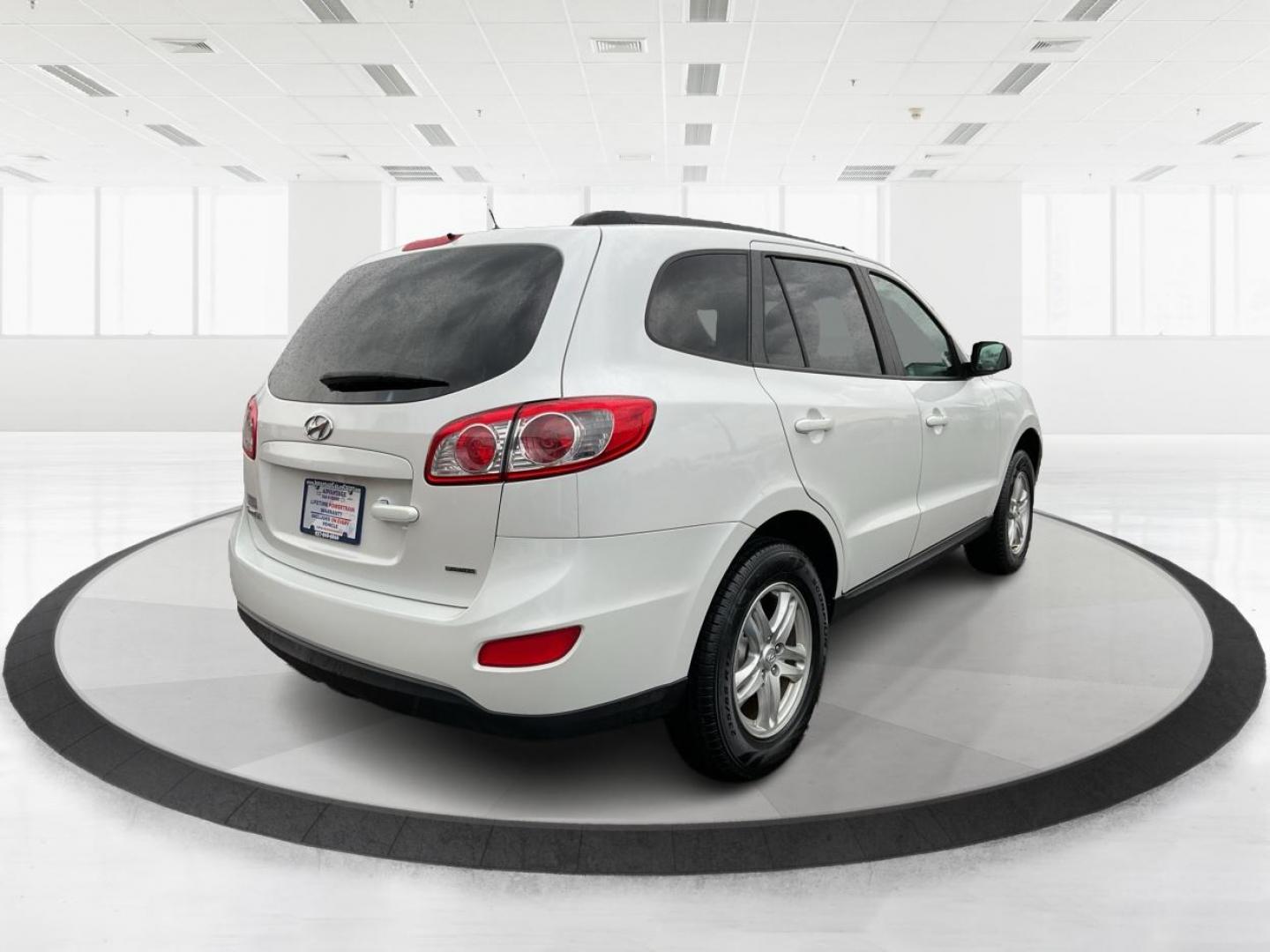 2012 Hyundai Santa Fe GLS (5XYZGDAB5CG) with an 2.4L I-4 DOHC engine, located at 1099 N County Rd 25A , Troy, OH, 45373, (937) 908-9800, 40.057079, -84.212883 - Photo#2