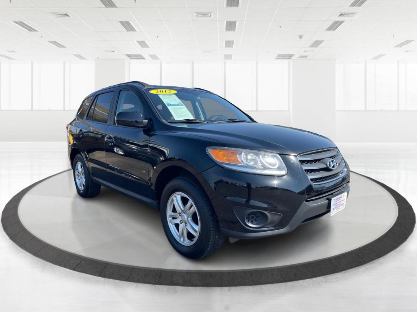 2012 Hyundai Santa Fe GLS (5XYZG3ABXCG) with an 2.4L I-4 DOHC engine, located at 401 Woodman Dr, Riverside, OH, 45431, (937) 908-9800, 39.760899, -84.123421 - Photo#0