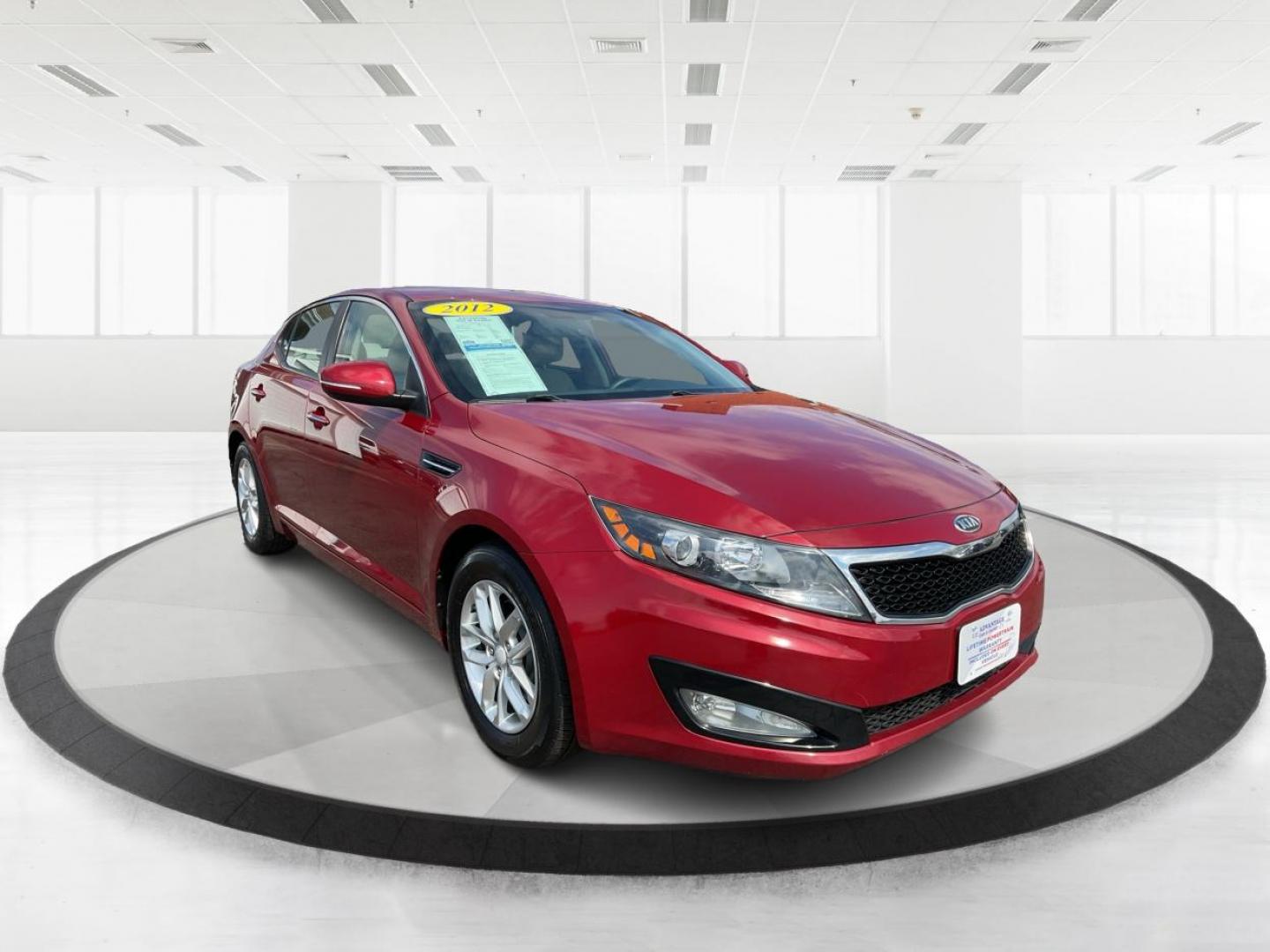 2012 Spicy Red Metallic Kia Optima LX AT (5XXGM4A73CG) with an 2.4L L4 DOHC 16V engine, 6-Speed Automatic transmission, located at 1099 N County Rd 25A , Troy, OH, 45373, (937) 908-9800, 40.057079, -84.212883 - Photo#0