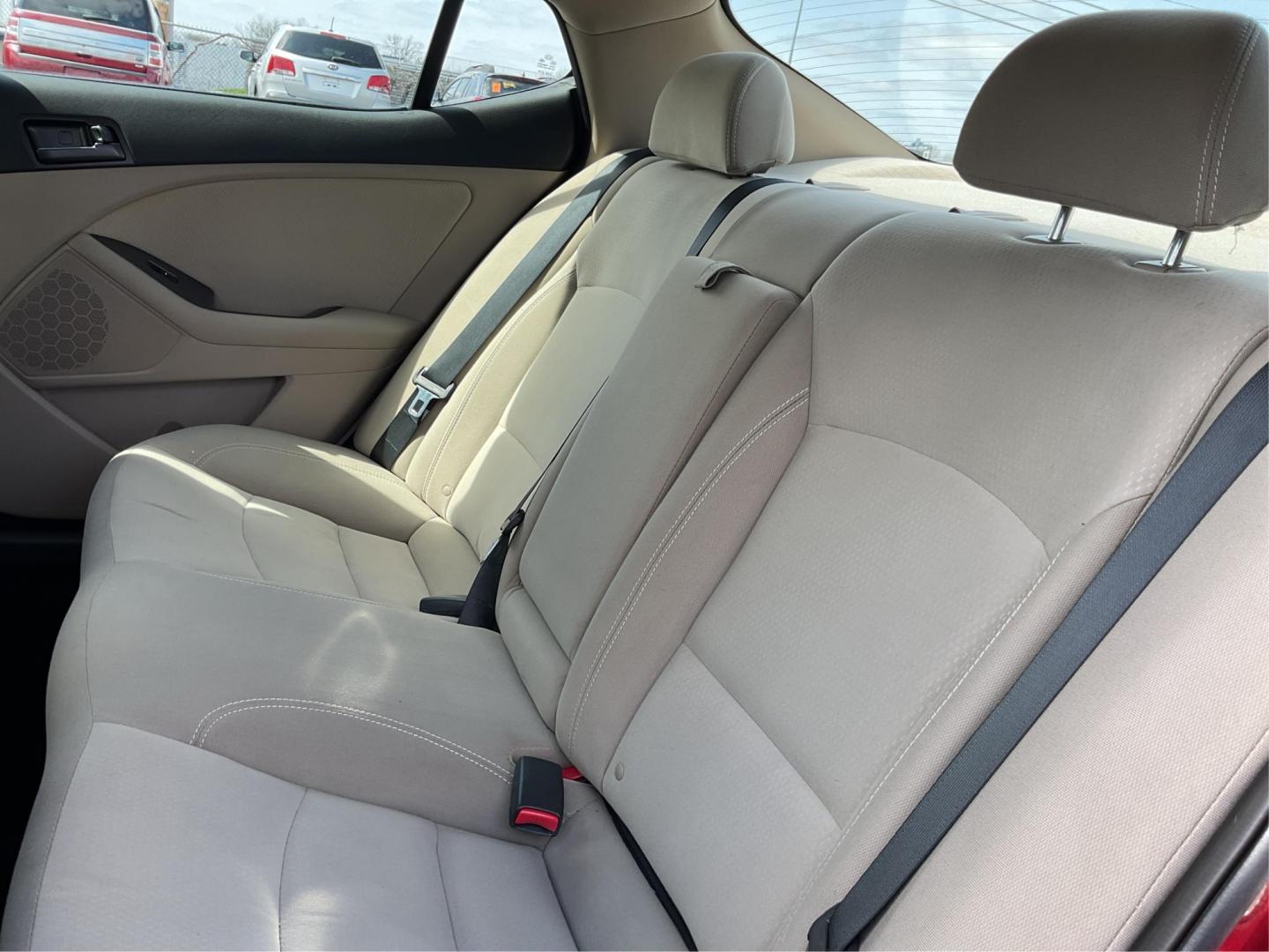 2012 Spicy Red Metallic Kia Optima LX AT (5XXGM4A73CG) with an 2.4L L4 DOHC 16V engine, 6-Speed Automatic transmission, located at 1099 N County Rd 25A , Troy, OH, 45373, (937) 908-9800, 40.057079, -84.212883 - Photo#9