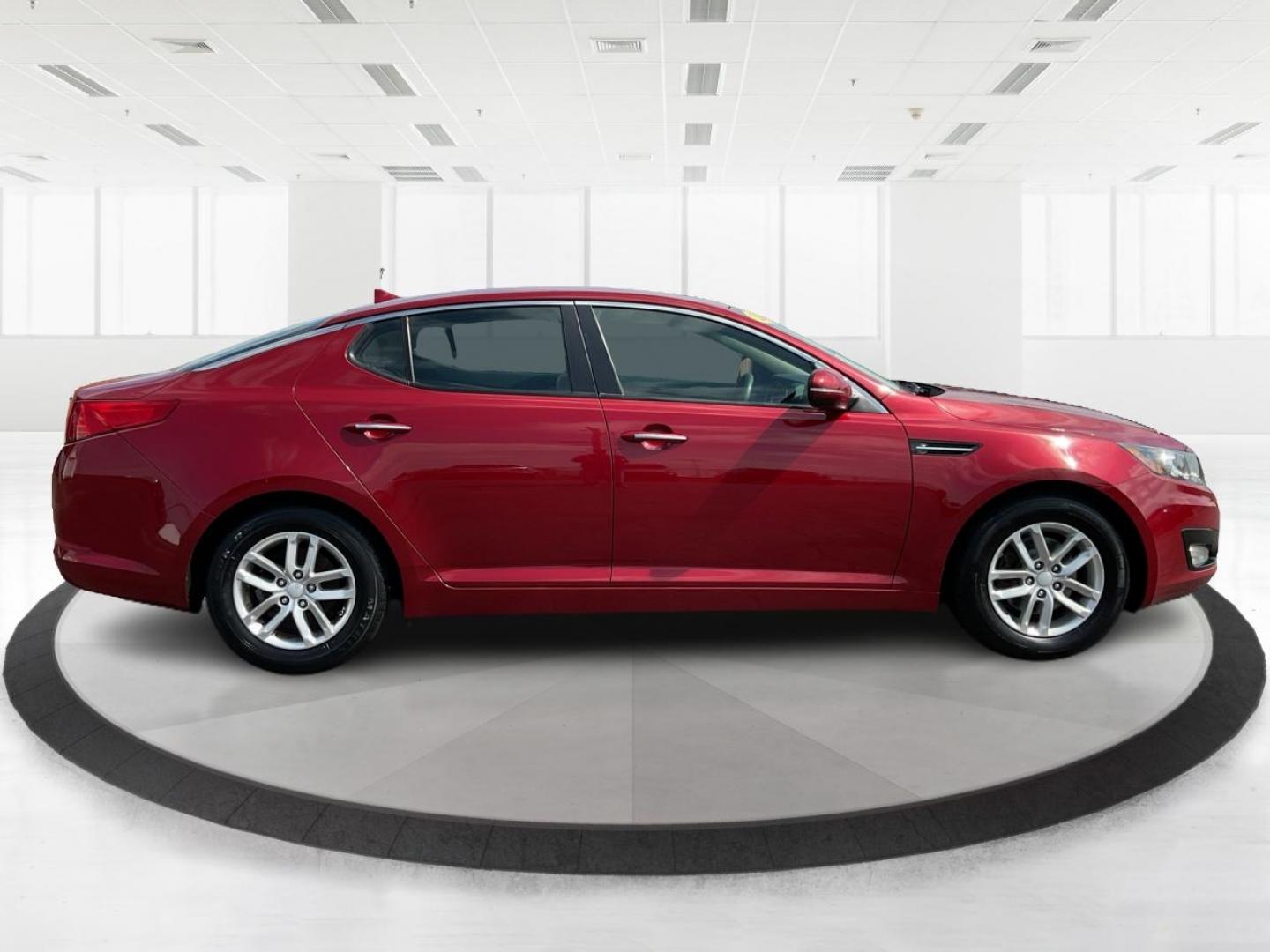 2012 Spicy Red Metallic Kia Optima LX AT (5XXGM4A73CG) with an 2.4L L4 DOHC 16V engine, 6-Speed Automatic transmission, located at 1099 N County Rd 25A , Troy, OH, 45373, (937) 908-9800, 40.057079, -84.212883 - Photo#1