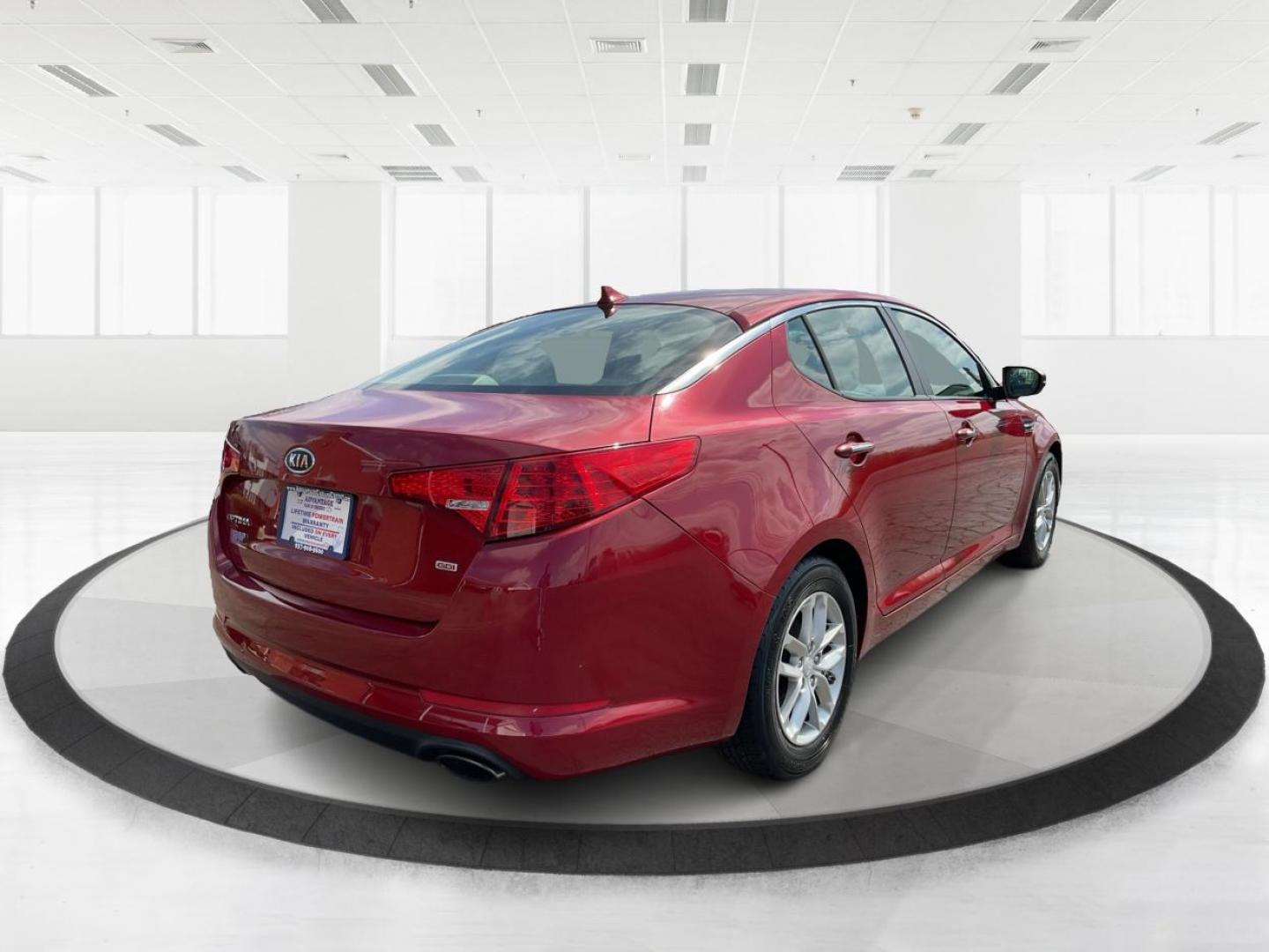 2012 Spicy Red Metallic Kia Optima LX AT (5XXGM4A73CG) with an 2.4L L4 DOHC 16V engine, 6-Speed Automatic transmission, located at 1099 N County Rd 25A , Troy, OH, 45373, (937) 908-9800, 40.057079, -84.212883 - Photo#2