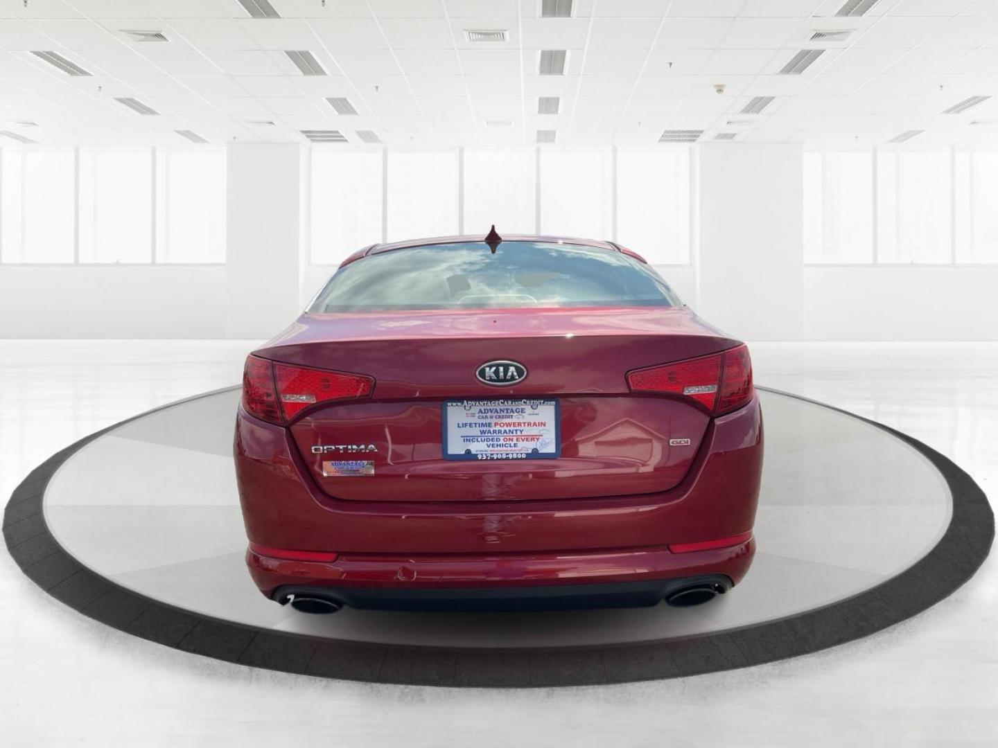 2012 Spicy Red Metallic Kia Optima LX AT (5XXGM4A73CG) with an 2.4L L4 DOHC 16V engine, 6-Speed Automatic transmission, located at 1099 N County Rd 25A , Troy, OH, 45373, (937) 908-9800, 40.057079, -84.212883 - Photo#3