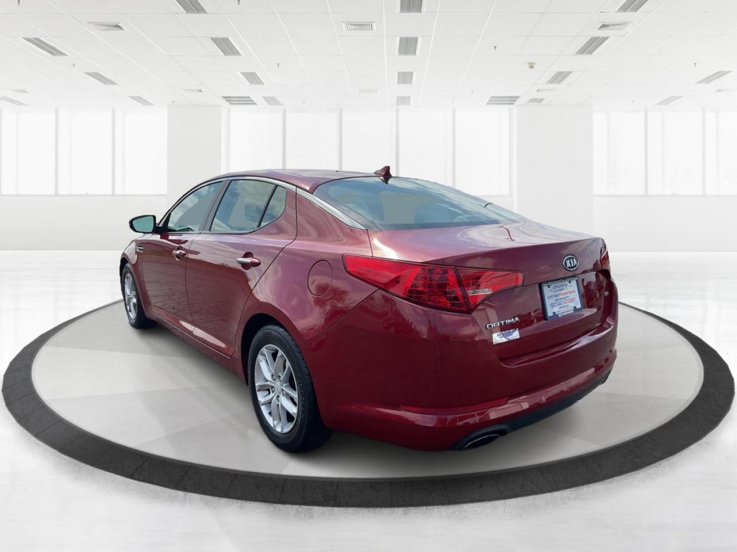 2012 Spicy Red Metallic Kia Optima LX AT (5XXGM4A73CG) with an 2.4L L4 DOHC 16V engine, 6-Speed Automatic transmission, located at 1099 N County Rd 25A , Troy, OH, 45373, (937) 908-9800, 40.057079, -84.212883 - Photo#4