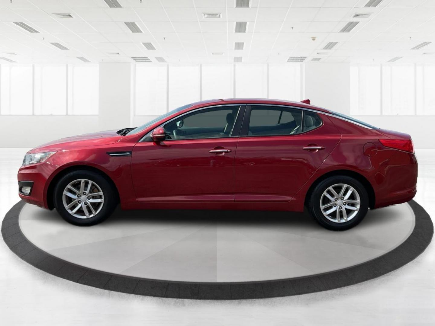 2012 Spicy Red Metallic Kia Optima LX AT (5XXGM4A73CG) with an 2.4L L4 DOHC 16V engine, 6-Speed Automatic transmission, located at 1099 N County Rd 25A , Troy, OH, 45373, (937) 908-9800, 40.057079, -84.212883 - Photo#5