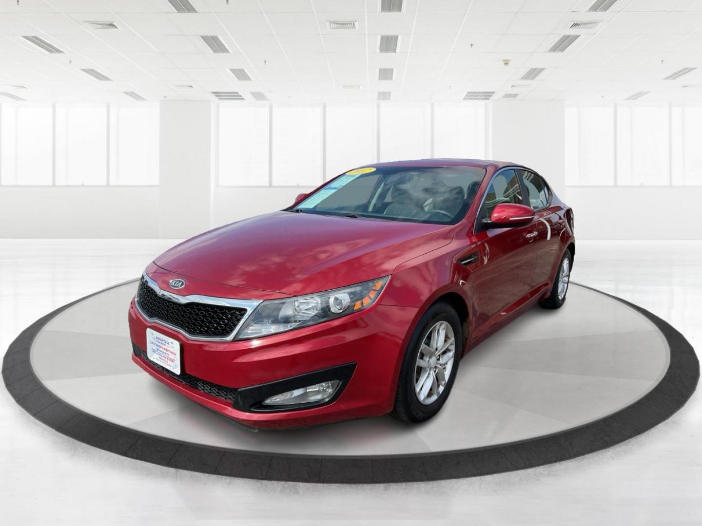 2012 Spicy Red Metallic Kia Optima LX AT (5XXGM4A73CG) with an 2.4L L4 DOHC 16V engine, 6-Speed Automatic transmission, located at 1099 N County Rd 25A , Troy, OH, 45373, (937) 908-9800, 40.057079, -84.212883 - Photo#7