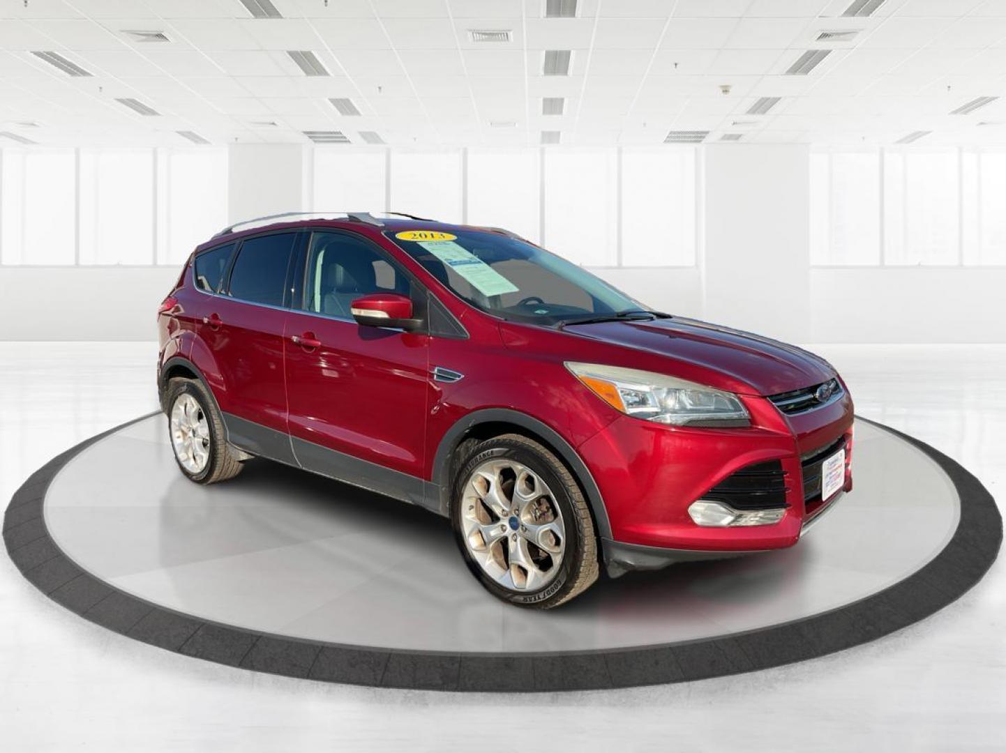 2013 Ford Escape Titanium (1FMCU0J94DU) with an EcoBoost 2L I-4 gasoline direct injection engine, located at 1184 Kauffman Ave, Fairborn, OH, 45324, (937) 908-9800, 39.807072, -84.030914 - Photo#0