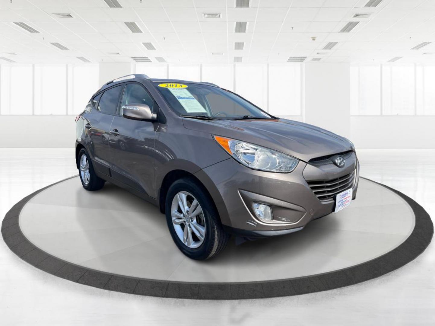 2013 Hyundai Tucson GLS (KM8JU3AC1DU) with an Theta II 2.4L I-4 DOHC engine, located at 1099 N County Rd 25A , Troy, OH, 45373, (937) 908-9800, 40.057079, -84.212883 - Photo#0
