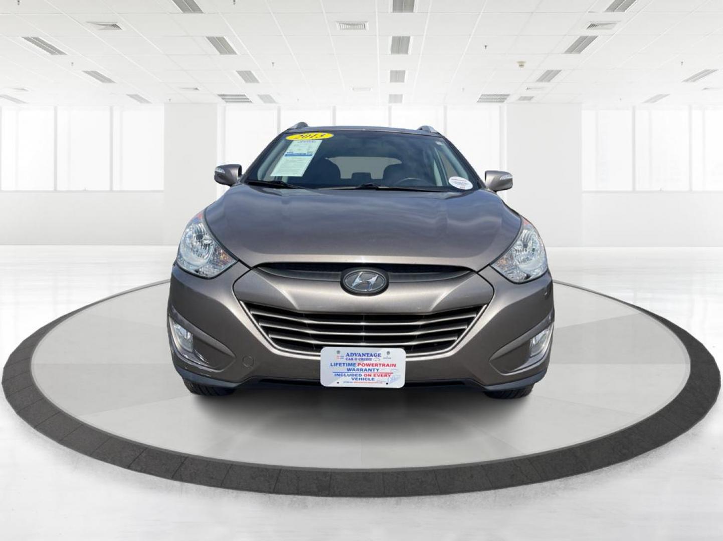 2013 Hyundai Tucson GLS (KM8JU3AC1DU) with an Theta II 2.4L I-4 DOHC engine, located at 1099 N County Rd 25A , Troy, OH, 45373, (937) 908-9800, 40.057079, -84.212883 - Photo#6