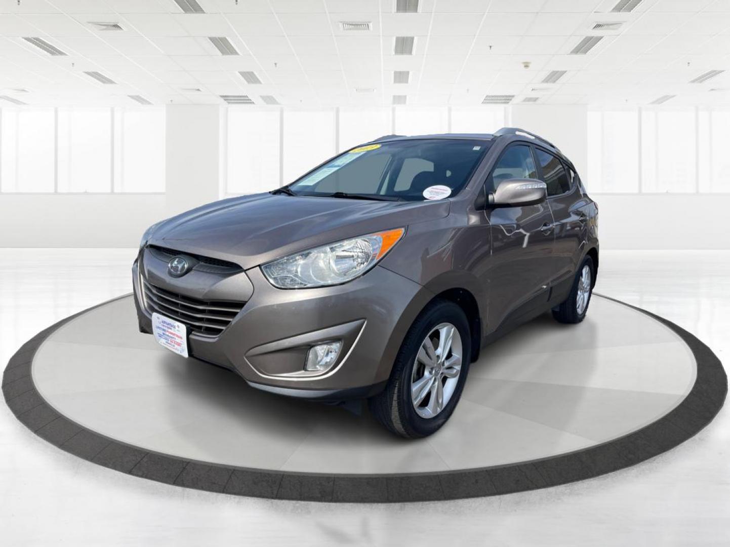2013 Hyundai Tucson GLS (KM8JU3AC1DU) with an Theta II 2.4L I-4 DOHC engine, located at 1099 N County Rd 25A , Troy, OH, 45373, (937) 908-9800, 40.057079, -84.212883 - Photo#7