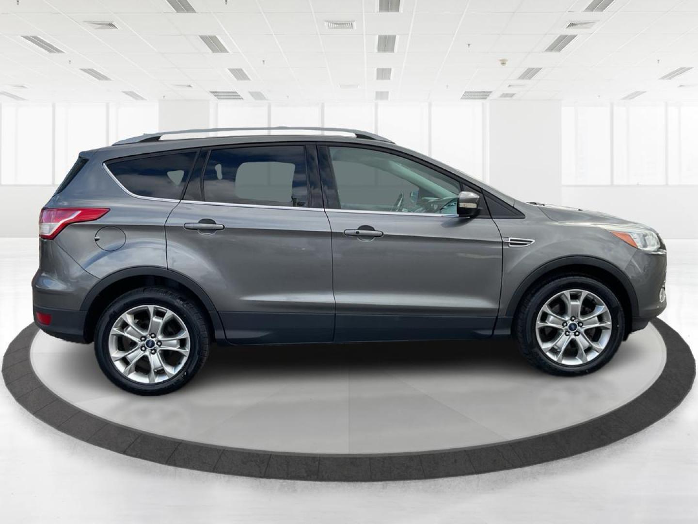 2014 Ford Escape Titanium (1FMCU9J95EU) with an EcoBoost 1.6L I-4 gasoline direct injection engine, located at 8750 N County Rd 25A, Piqua, OH, 45356, (937) 908-9800, 40.164391, -84.232513 - Photo#1