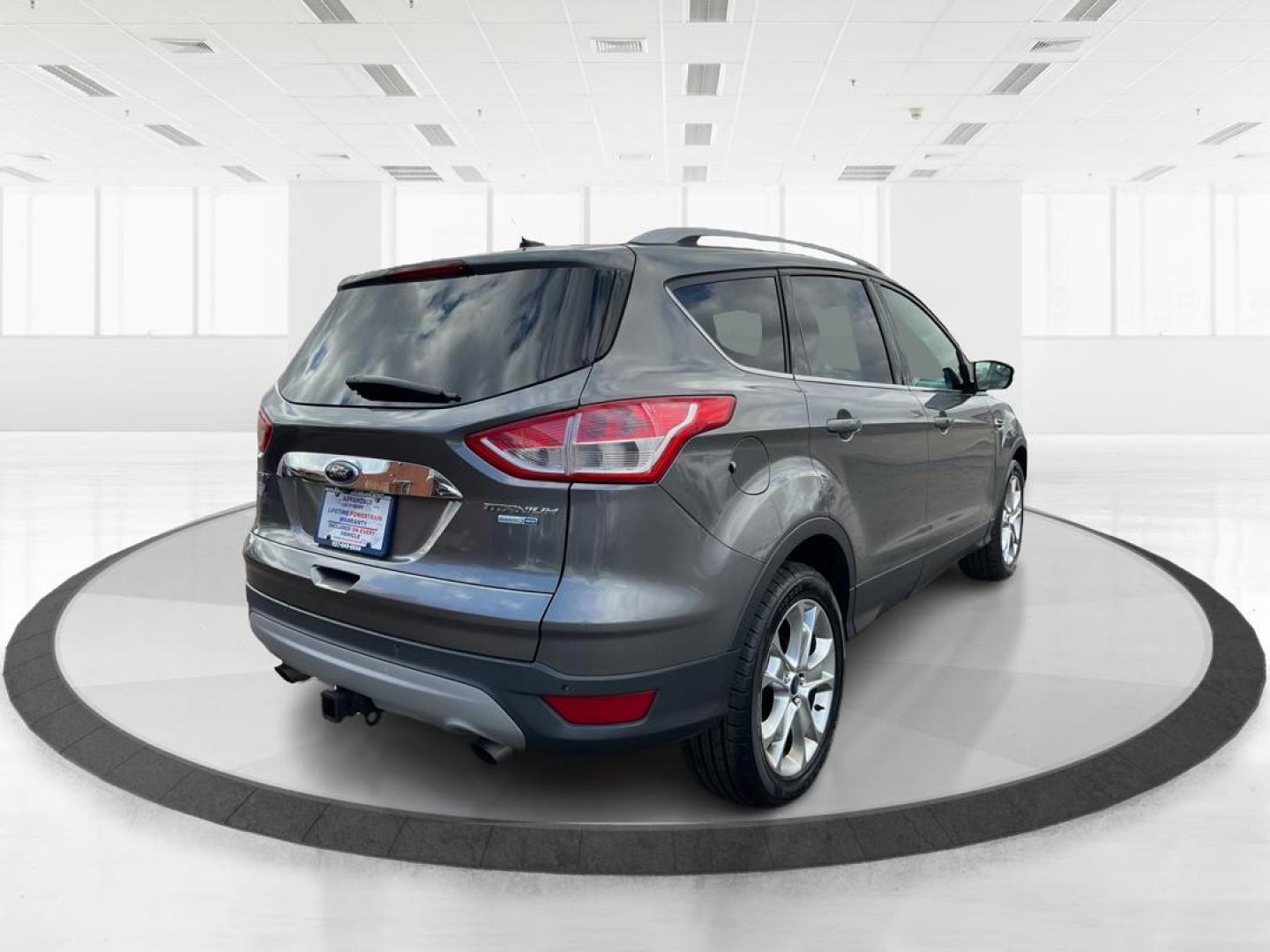 2014 Ford Escape Titanium (1FMCU9J95EU) with an EcoBoost 1.6L I-4 gasoline direct injection engine, located at 8750 N County Rd 25A, Piqua, OH, 45356, (937) 908-9800, 40.164391, -84.232513 - Photo#2