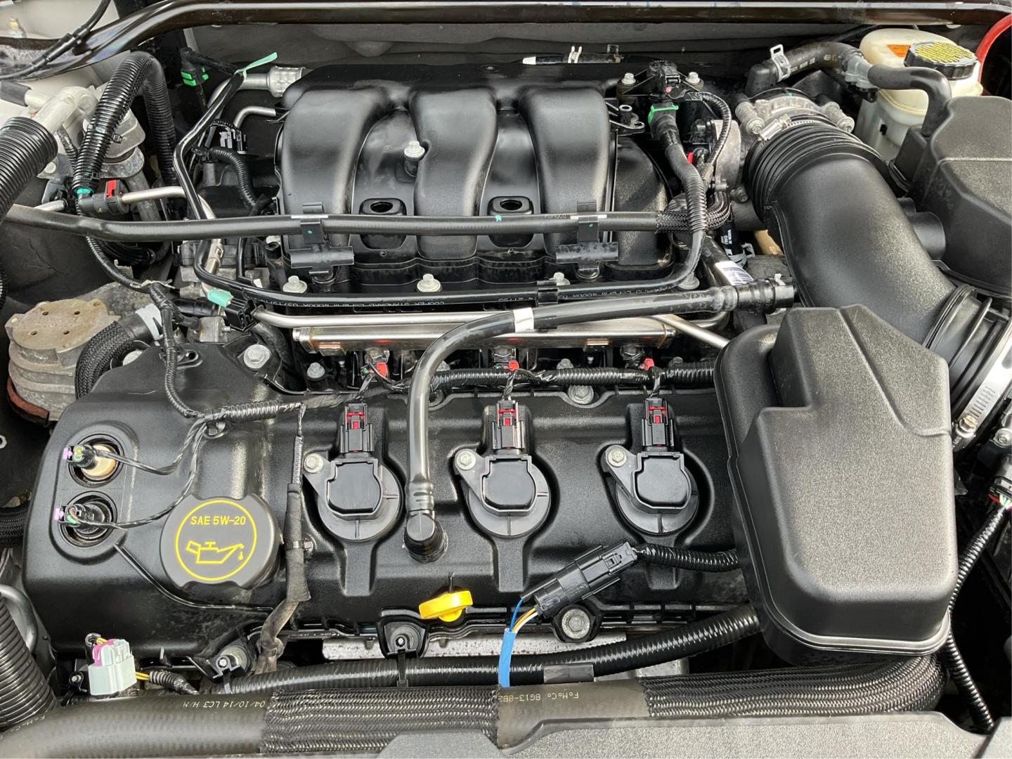 2014 Ford Taurus SEL (1FAHP2E86EG) with an EcoBoost 2L I-4 gasoline direct injection engine, located at 1099 N County Rd 25A , Troy, OH, 45373, (937) 908-9800, 40.057079, -84.212883 - Photo#11