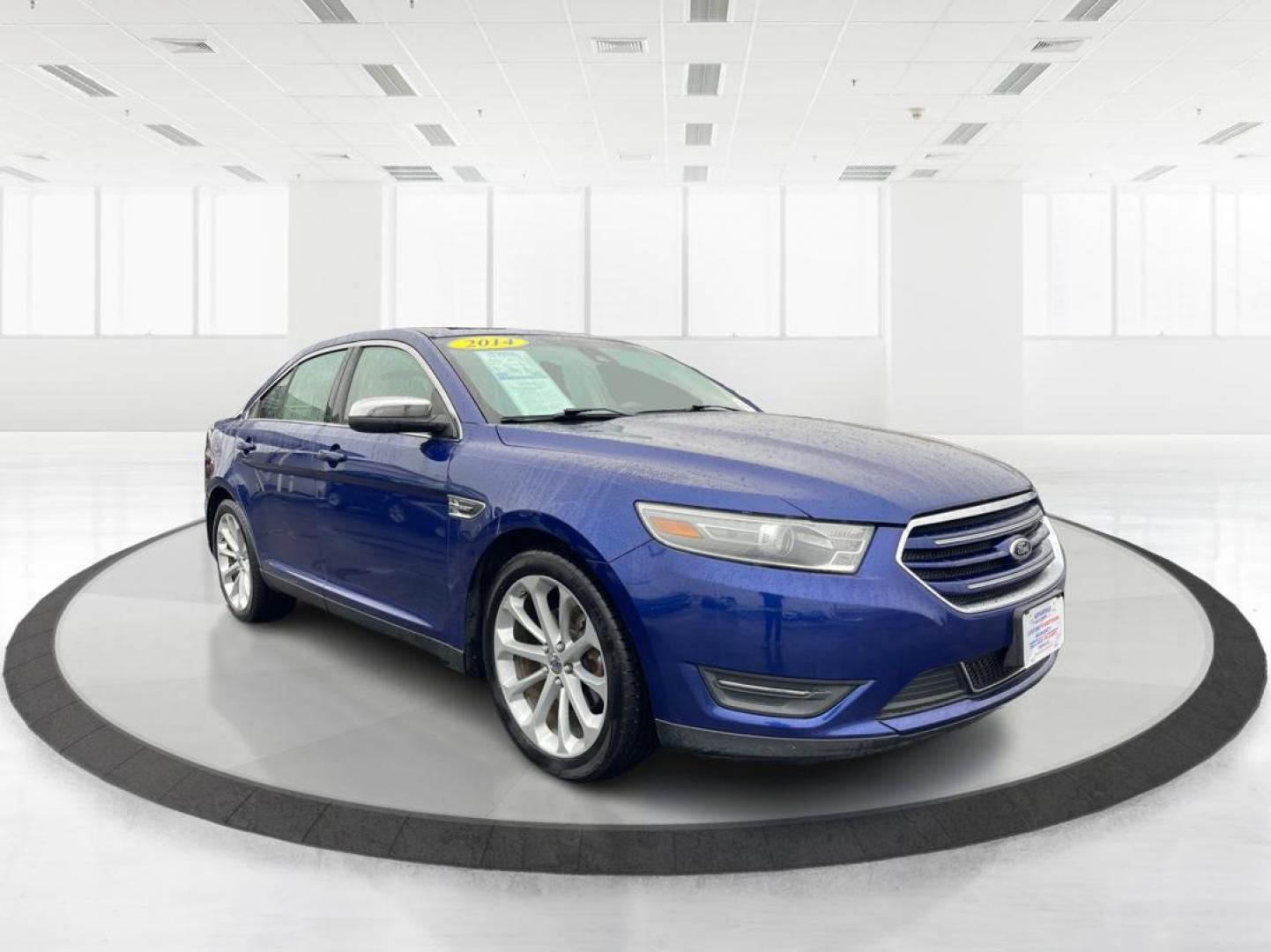 2014 Deep Impact Blue Metallic Ford Taurus Limited AWD (1FAHP2J86EG) with an 3.5L V6 DOHC 24V engine, 6-Speed Automatic transmission, located at 1184 Kauffman Ave, Fairborn, OH, 45324, (937) 908-9800, 39.807072, -84.030914 - Photo#0