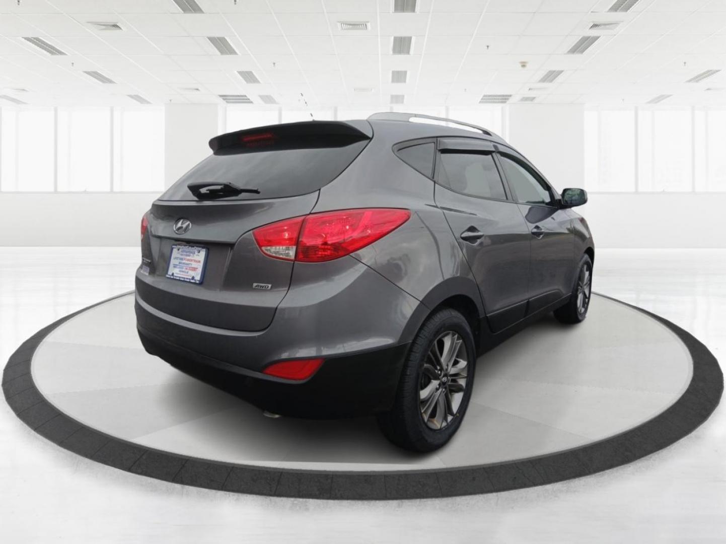 2014 Hyundai Tucson GLS AWD (KM8JUCAGXEU) with an 2.4L L4 DOHC 16V engine, 6-Speed Automatic transmission, located at 880 E. National Road, Vandalia, OH, 45377, (937) 908-9800, 39.891918, -84.183594 - Photo#2