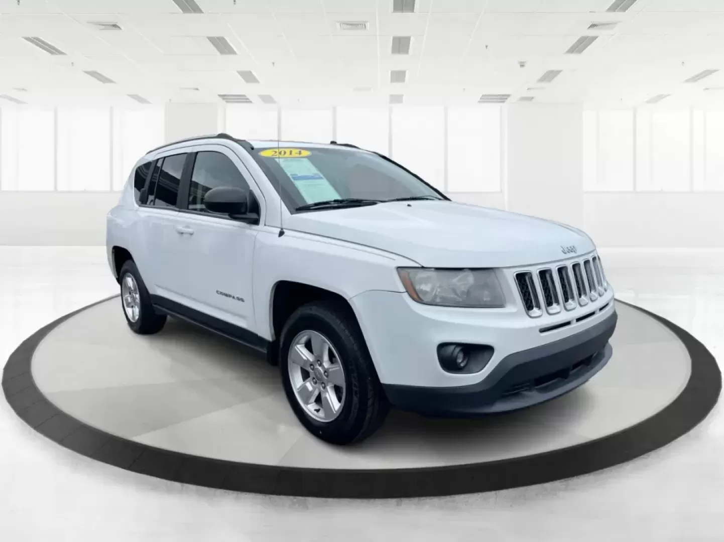 2014 Bright White Clearcoat Jeep Compass Sport FWD (1C4NJCBA9ED) with an 2.0L L4 DOHC 16V engine, located at 880 E. National Road, Vandalia, OH, 45377, (937) 908-9800, 39.891918, -84.183594 - Photo#0