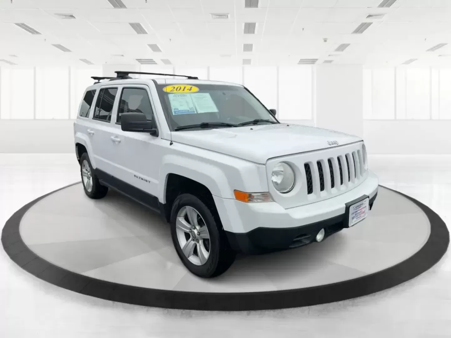 2014 Jeep Patriot Latitude (1C4NJRFB4ED) with an 2.4L I-4 DOHC engine, located at 1230 East Main St, Xenia, OH, 45385, (937) 908-9800, 39.688026, -83.910172 - Photo#0
