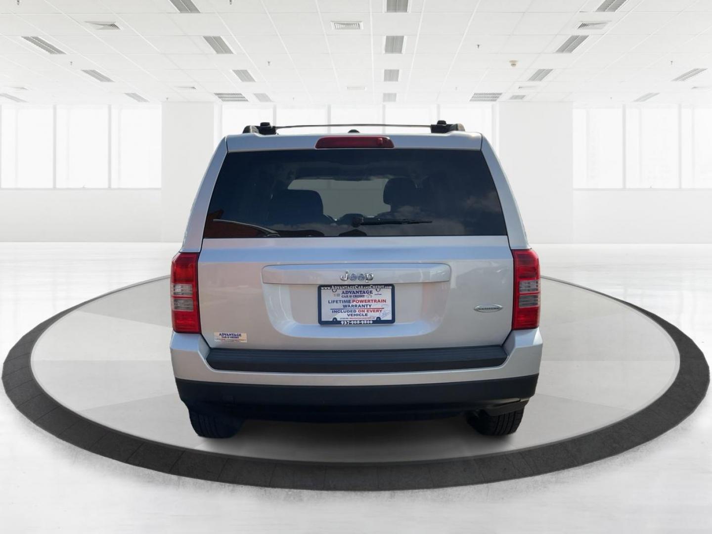 2014 Bright Silver Metallic CC Jeep Patriot Latitude 2WD (1C4NJPFA5ED) with an 2.0L L4 DOHC 16V engine, located at 880 E. National Road, Vandalia, OH, 45377, (937) 908-9800, 39.891918, -84.183594 - Photo#2