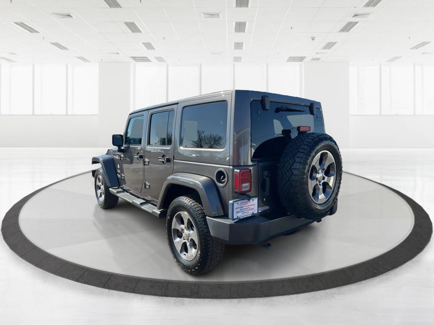2016 Jeep Wrangler Unlimited Sahara 4WD (1C4BJWEG2GL) with an 3.6L V6 DOHC 24V FFV engine, located at 8750 N County Rd 25A, Piqua, OH, 45356, (937) 908-9800, 40.164391, -84.232513 - Photo#3