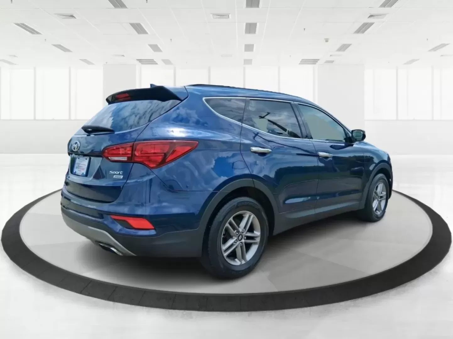 2017 Hyundai Santa Fe 2.4L (5XYZUDLB0HG) with an Theta II 2.4L I-4 gasoline direct injection engine, located at 1230 East Main St, Xenia, OH, 45385, (937) 908-9800, 39.688026, -83.910172 - Photo#2