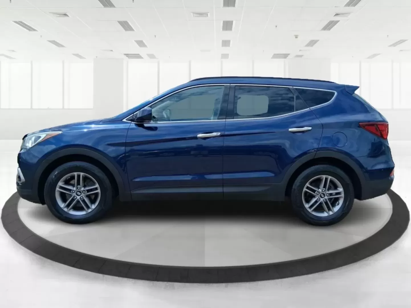 2017 Hyundai Santa Fe 2.4L (5XYZUDLB0HG) with an Theta II 2.4L I-4 gasoline direct injection engine, located at 1230 East Main St, Xenia, OH, 45385, (937) 908-9800, 39.688026, -83.910172 - Photo#5