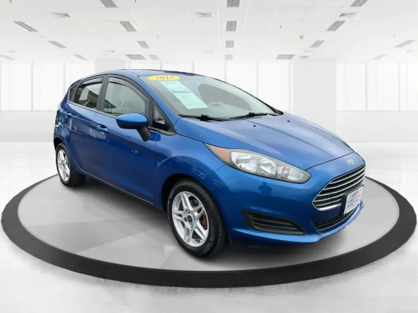 2018 Ford Fiesta SE (3FADP4EJ2JM) with an 1.6L I-4 DOHC engine, located at 8750 N County Rd 25A, Piqua, OH, 45356, (937) 908-9800, 40.164391, -84.232513 - Photo#0