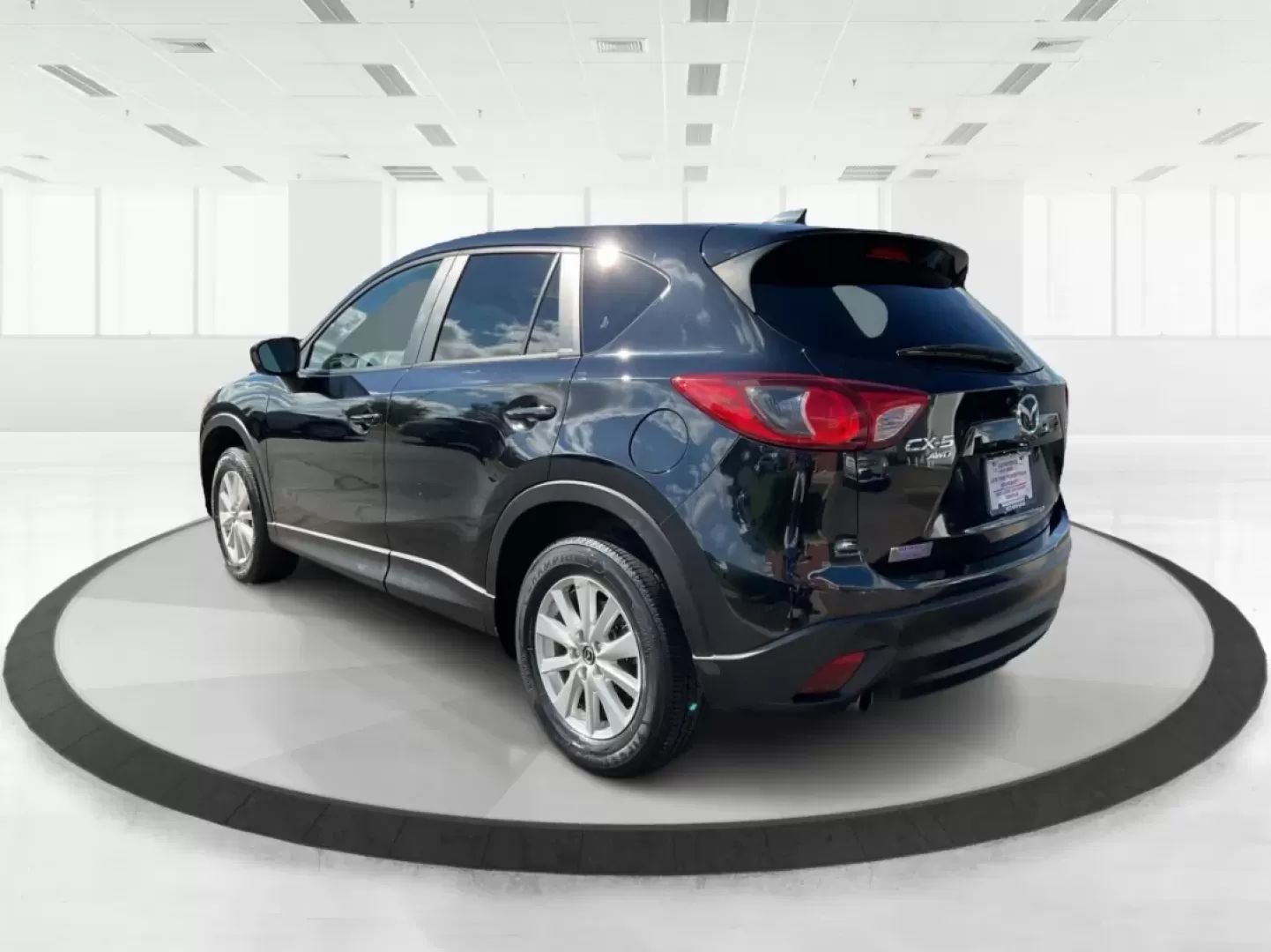 2014 Jet Black Mica Mazda CX-5 Touring AWD (JM3KE4CY2E0) with an 2.5L L4 DOHC 16V engine, 6-Speed Automatic transmission, located at 880 E. National Road, Vandalia, OH, 45377, (937) 908-9800, 39.891918, -84.183594 - **Explore the Open Road in the 2014 Mazda CX-5 Touring AWD from Advantage Car and Credit - Troy!**<br /> <br /> Are you ready to elevate your driving experience? Whether you're a growing family seeking a reliable SUV for weekend adventures, a commuter looking for comfort on long drives, or a budget- - Photo#4