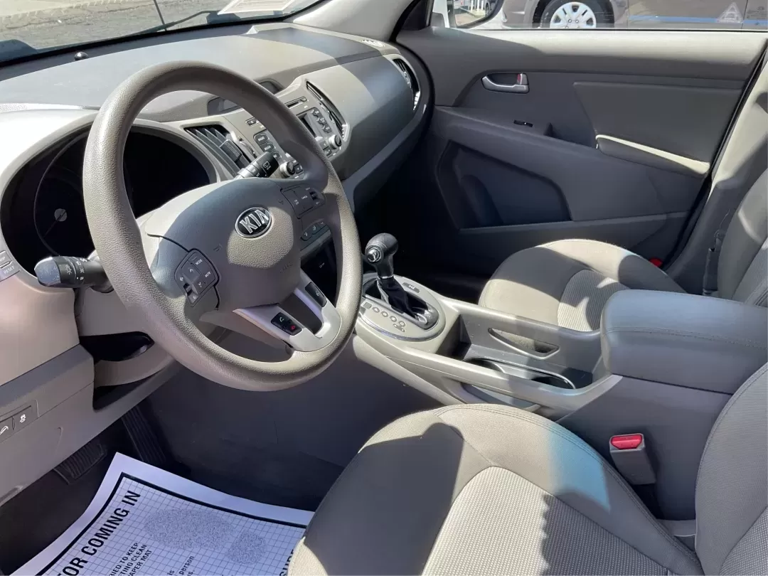 2015 Kia Sportage LX (KNDPBCAC7F7) with an Other engine, located at 880 E. National Road, Vandalia, OH, 45377, (937) 908-9800, 39.891918, -84.183594 - **Explore the Open Road with the 2015 Kia Sportage LX Perfect for Your Next Adventure!**<br /> <br /> Imagine hitting the open road with your loved ones, whether it's a weekend getaway or a daily commute. The 2015 Kia Sportage LX, available at Advantage Car and Credit in Fairborn, OH, is the ideal - Photo#9