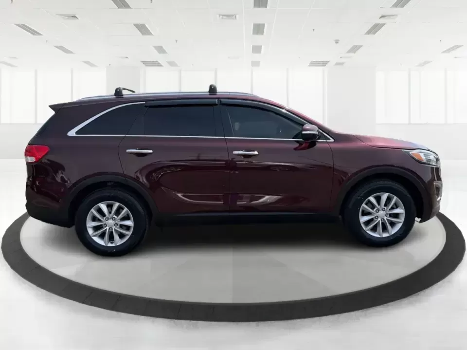 2017 Burgundy Kia Sorento L 2WD (5XYPG4A31HG) with an 2.4L L4 DOHC 16V engine, 6-Speed Automatic transmission, located at 4508 South Dixie Dr, Moraine, OH, 45439, (937) 908-9800, 39.689976, -84.218452 - Pack up the kids, load the groceries, and still have room for a spontaneous weekend escape to Carillon Historical Park or a day exploring Cox Arboretum-this 2017 Kia Sorento L 2WD is the kind of practical SUV that fits real Moraine and Dayton-area life. With three-row versatility in a midsize footpr - Photo#1