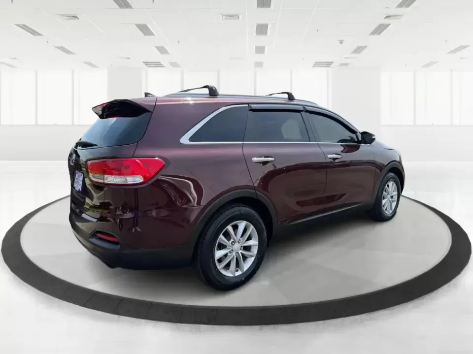 2017 Burgundy Kia Sorento L 2WD (5XYPG4A31HG) with an 2.4L L4 DOHC 16V engine, 6-Speed Automatic transmission, located at 4508 South Dixie Dr, Moraine, OH, 45439, (937) 908-9800, 39.689976, -84.218452 - Pack up the kids, load the groceries, and still have room for a spontaneous weekend escape to Carillon Historical Park or a day exploring Cox Arboretum-this 2017 Kia Sorento L 2WD is the kind of practical SUV that fits real Moraine and Dayton-area life. With three-row versatility in a midsize footpr - Photo#2