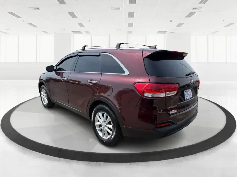2017 Burgundy Kia Sorento L 2WD (5XYPG4A31HG) with an 2.4L L4 DOHC 16V engine, 6-Speed Automatic transmission, located at 4508 South Dixie Dr, Moraine, OH, 45439, (937) 908-9800, 39.689976, -84.218452 - Pack up the kids, load the groceries, and still have room for a spontaneous weekend escape to Carillon Historical Park or a day exploring Cox Arboretum-this 2017 Kia Sorento L 2WD is the kind of practical SUV that fits real Moraine and Dayton-area life. With three-row versatility in a midsize footpr - Photo#4
