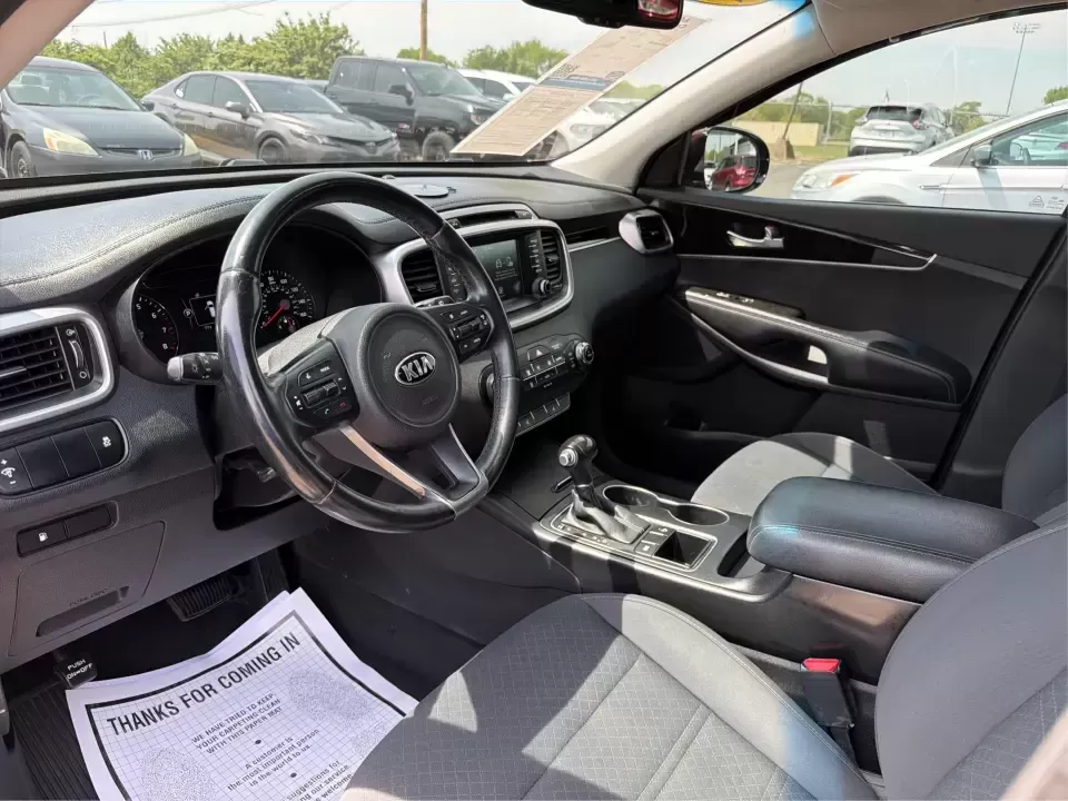 2017 Burgundy Kia Sorento L 2WD (5XYPG4A31HG) with an 2.4L L4 DOHC 16V engine, 6-Speed Automatic transmission, located at 4508 South Dixie Dr, Moraine, OH, 45439, (937) 908-9800, 39.689976, -84.218452 - Pack up the kids, load the groceries, and still have room for a spontaneous weekend escape to Carillon Historical Park or a day exploring Cox Arboretum-this 2017 Kia Sorento L 2WD is the kind of practical SUV that fits real Moraine and Dayton-area life. With three-row versatility in a midsize footpr - Photo#9