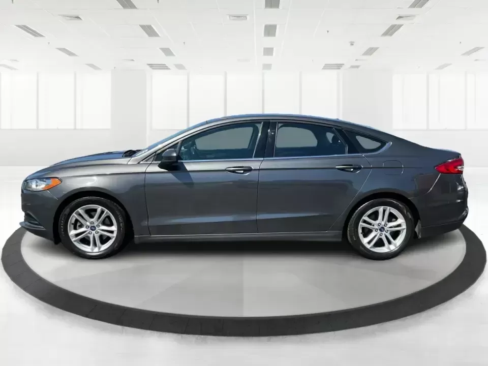 2018 Ford Fusion SE (3FA6P0HD3JR) with an 1.5L L4 DOHC 16V engine, 6A transmission, located at 1184 Kauffman Ave, Fairborn, OH, 45324, (937) 908-9800, 39.807072, -84.030914 - Looking for a reliable sedan that combines style, comfort, and practicality? Look no further than the 2018 Ford Fusion SE, available now at Advantage Car and Credit in Vandalia, OH! Perfect for your daily commute, family outings, or even weekend adventures, this vehicle is designed to enhance your l - Photo#5