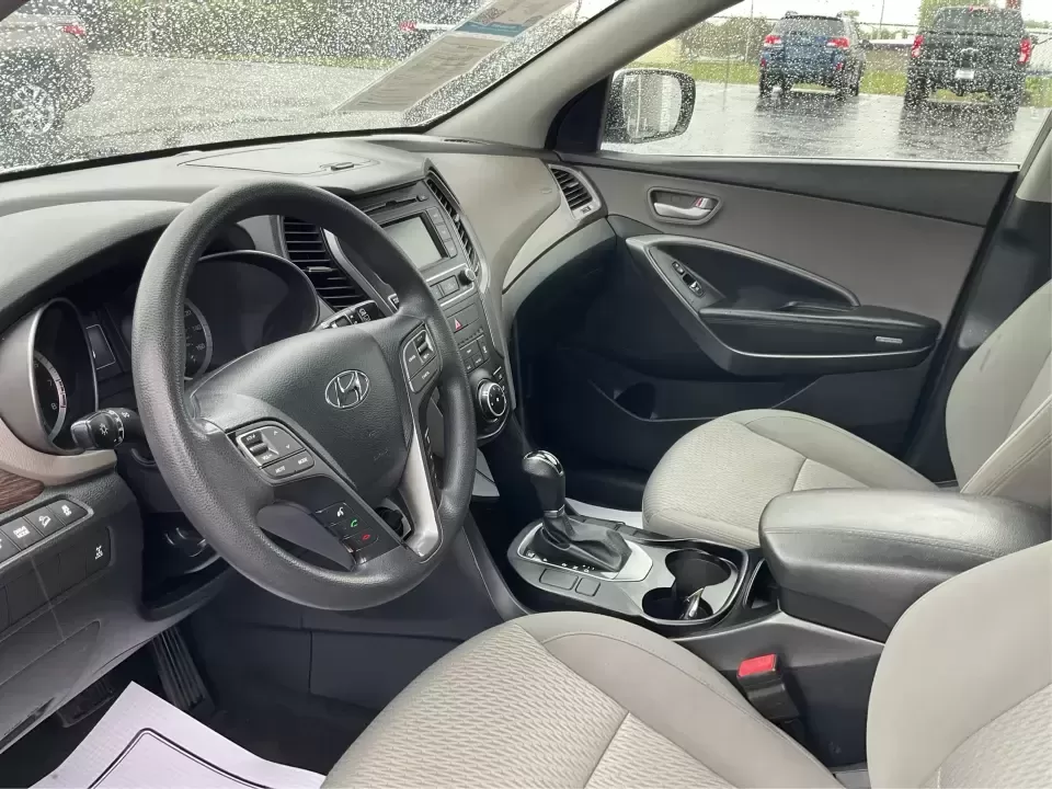 2017 Hyundai Santa Fe 2.4L (5XYZTDLB2HG) with an Theta II 2.4L I-4 gasoline direct injection engine, 6A transmission, located at 8750 N County Rd 25A, Piqua, OH, 45356, (937) 908-9800, 40.164391, -84.232513 - Discover the perfect blend of comfort, capability, and style with the 2017 Hyundai Santa Fe, now available at Advantage Car and Credit, located at 1184 Kauffman Ave, Fairborn, OH 45324. This versatile SUV is an excellent choice for growing families, weekend adventurers, or budget-conscious buyers lo - Photo#9