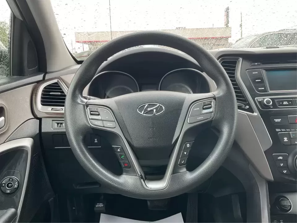 2017 Hyundai Santa Fe 2.4L (5XYZTDLB2HG) with an Theta II 2.4L I-4 gasoline direct injection engine, 6A transmission, located at 8750 N County Rd 25A, Piqua, OH, 45356, (937) 908-9800, 40.164391, -84.232513 - Discover the perfect blend of comfort, capability, and style with the 2017 Hyundai Santa Fe, now available at Advantage Car and Credit, located at 1184 Kauffman Ave, Fairborn, OH 45324. This versatile SUV is an excellent choice for growing families, weekend adventurers, or budget-conscious buyers lo - Photo#16