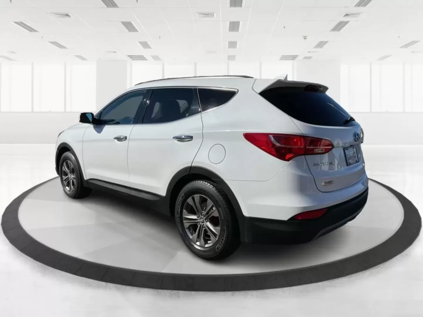 2014 Hyundai Santa Fe 2.4L (5XYZUDLB3EG) with an Theta II 2.4L I-4 gasoline direct injection engine, located at 1099 N County Rd 25A , Troy, OH, 45373, (937) 908-9800, 40.057079, -84.212883 - Are you ready to elevate your driving experience and embrace a lifestyle of adventure? The 2014 Hyundai Santa Fe available at Advantage Car and Credit in Troy, OH, is not just a vehicle; it's your gateway to unforgettable road trips, family outings, and daily commutes. This versatile SUV combines st - Photo#4