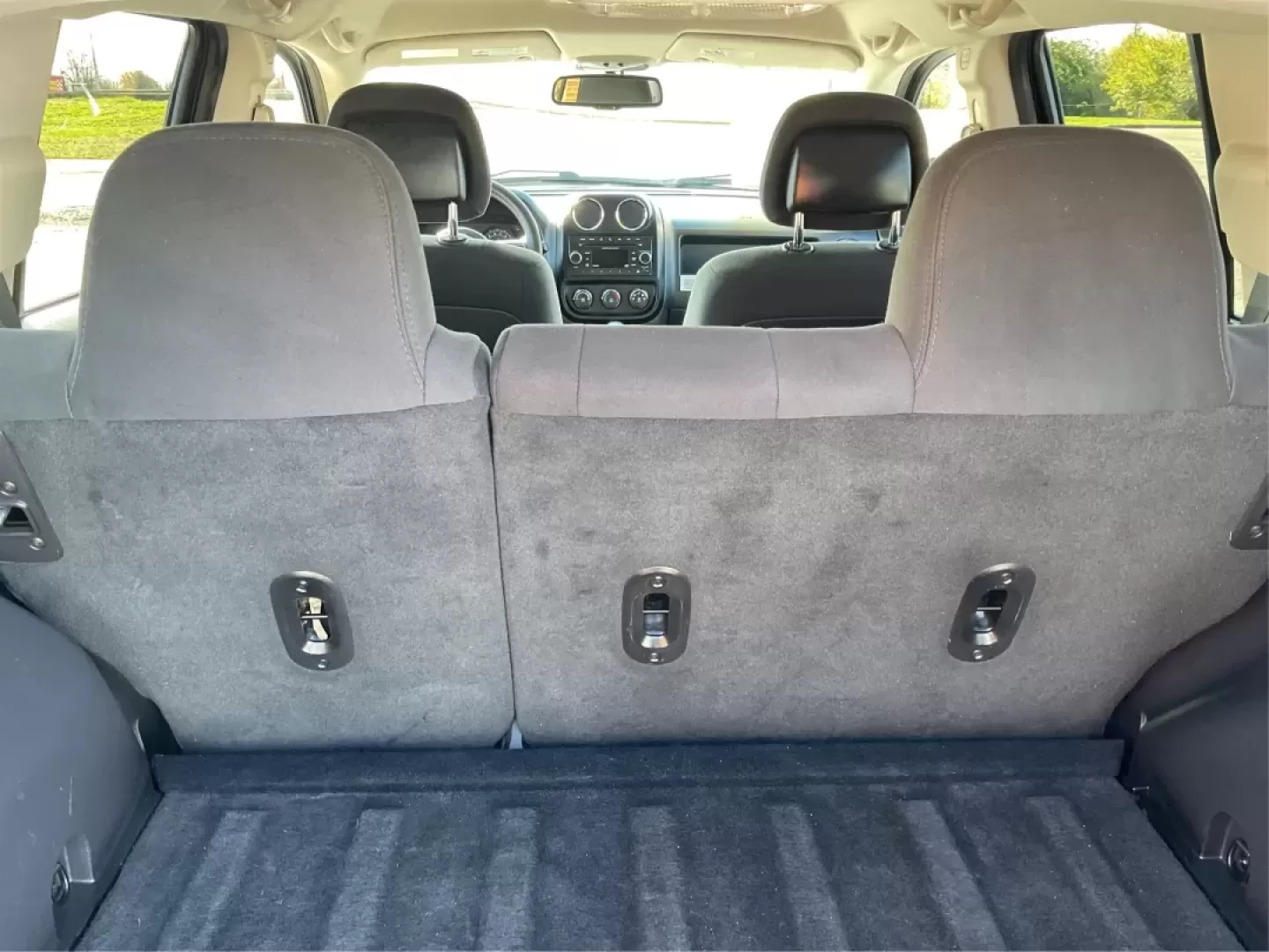 2014 Jeep Compass Sport (1C4NJDBB8ED) with an 2.4L I-4 DOHC engine, located at 1099 N County Rd 25A , Troy, OH, 45373, (937) 908-9800, 40.057079, -84.212883 - Discover the adventure-ready 2014 Jeep Compass, an SUV that's perfect for weekend getaways and daily commutes alike. Whether you're navigating the bustling streets of Troy or heading out on a family road trip to nearby attractions like the Miami County Fair, this rugged vehicle will elevate your dri - Photo#12