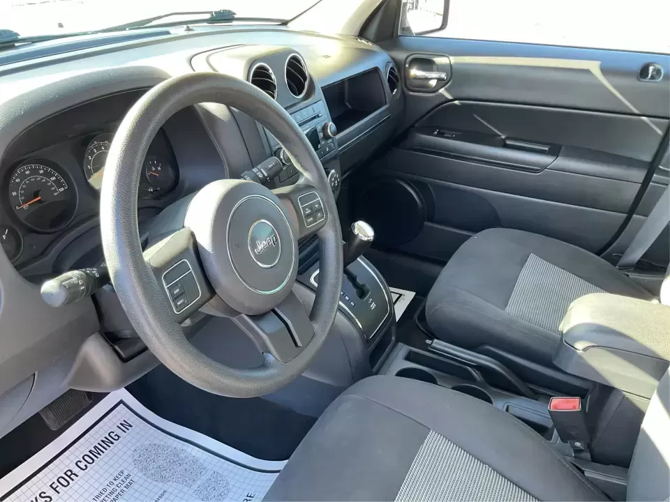 2016 Jeep Patriot Sport 2WD (1C4NJPBB6GD) with an 2.4L L4 DOHC 16V engine, Automatic transmission, located at 1951 S Dayton Lakeview Rd., New Carlisle, OH, 45344, (937) 908-9800, 39.890999, -84.050255 - Pack up the kids, load the cooler, and point the hood toward a weekend at Buck Creek State Park or an easy day trip to downtown Dayton-this 2016 Jeep Patriot Sport is the kind of compact SUV that fits real life in New Carlisle. With classic Jeep styling, practical cargo space, and everyday-friendly - Photo#9