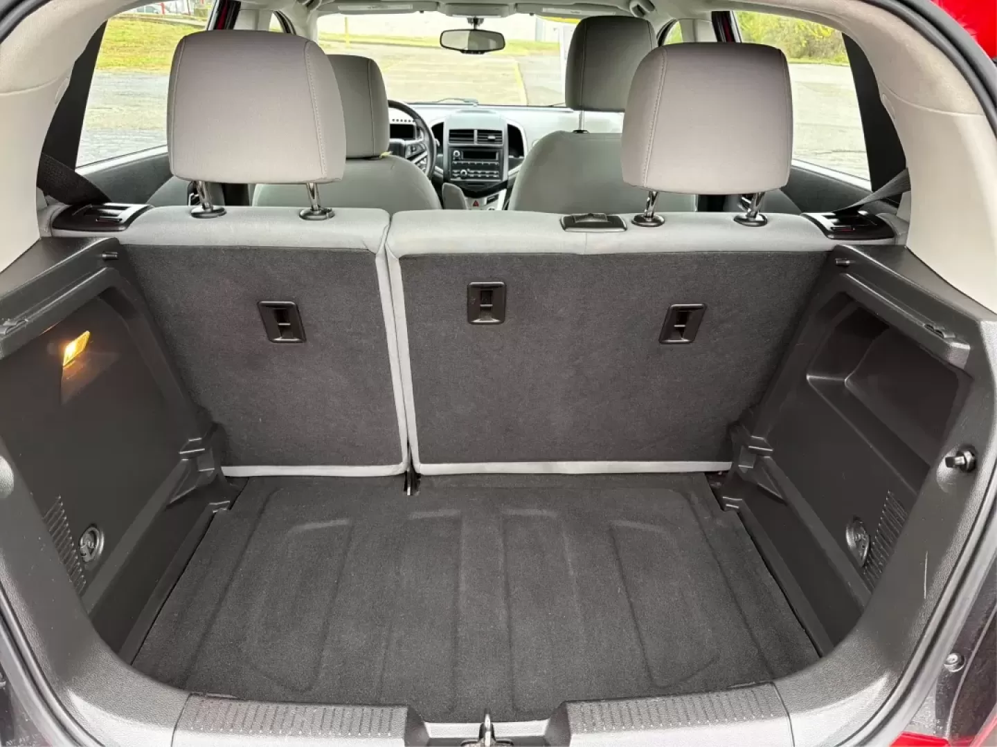 2014 Chevrolet Sonic LS Auto (1G1JA6SH1E4) with an Other engine, located at 1951 S Dayton Lakeview Rd., New Carlisle, OH, 45344, (937) 908-9800, 39.890999, -84.050255 - Are you in search of a reliable hatchback that perfectly balances style, efficiency, and practicality? Look no further than this stunning 2014 Chevrolet Sonic LS Auto, now available at Advantage Car and Credit in Riverside, OH. This vehicle is not just a mode of transportation; it's your new partner - Photo#12