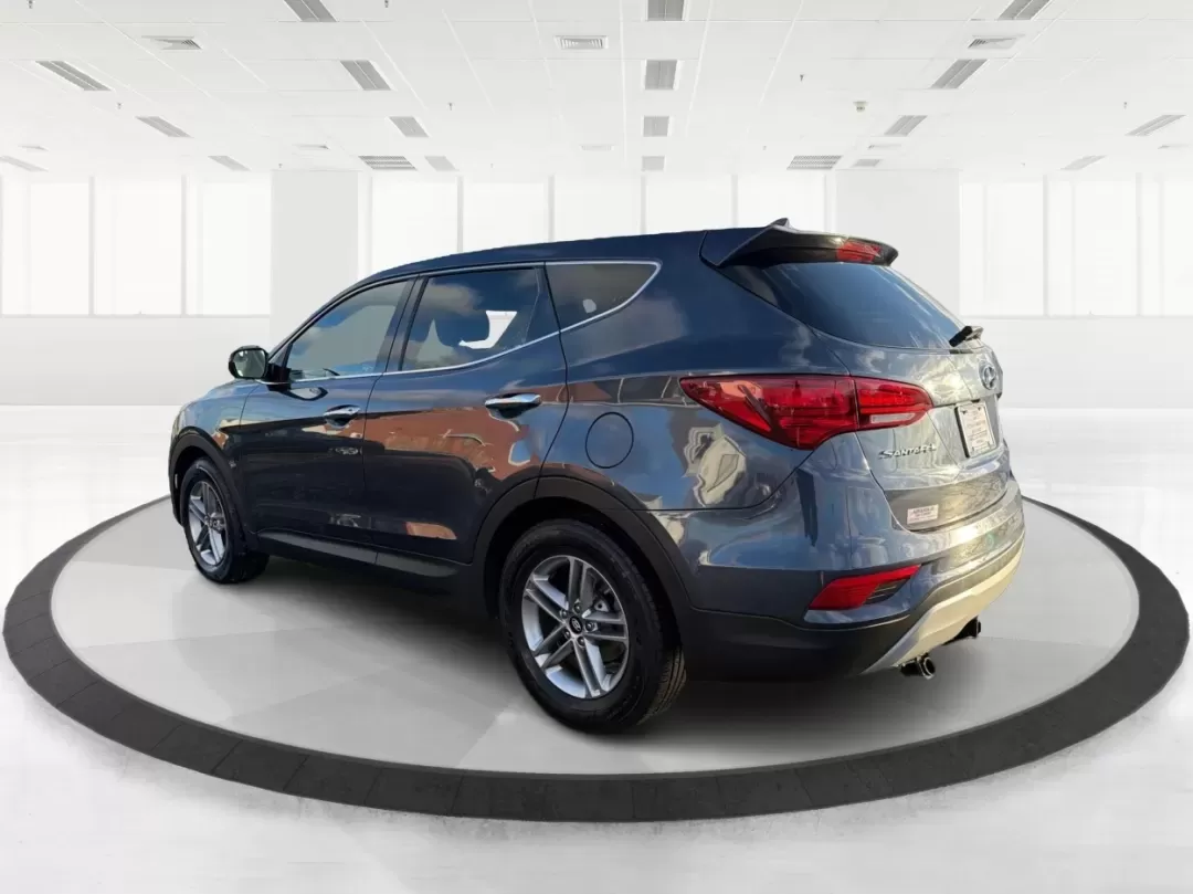 2017 Hyundai Santa Fe 2.4L (5NMZT3LBXHH) with an Theta II 2.4L I-4 gasoline direct injection engine, located at 880 E. National Road, Vandalia, OH, 45377, (937) 908-9800, 39.891918, -84.183594 - 2017 Hyundai Santa Fe 2.4L - Photo#4