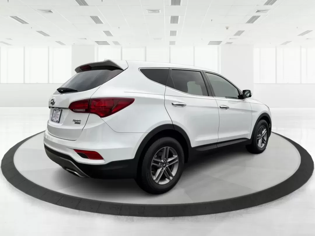 2017 Hyundai Santa Fe 2.4L (5NMZTDLB2HH) with an Theta II 2.4L I-4 gasoline direct injection engine, located at 1951 S Dayton Lakeview Rd., New Carlisle, OH, 45344, (937) 908-9800, 39.890999, -84.050255 - **Elevate Your Family Adventures with the 2017 Hyundai Santa Fe at Advantage Car and Credit!**<br /> <br /> Are you searching for the perfect vehicle to accommodate your growing family or to enhance your weekend getaways? Look no further! The 2017 Hyundai Santa Fe is a versatile and spacious SUV des - Photo#2