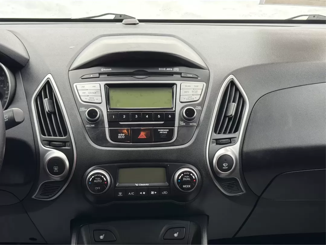 2012 Hyundai Tucson Limited (KM8JU3AC5CU) with an Theta II 2.4L I-4 DOHC engine, 6-Speed Automatic transmission, located at 880 E. National Road, Vandalia, OH, 45377, (937) 908-9800, 39.891918, -84.183594 - Need a dependable SUV that fits real life-school drop-offs, I-75 commuting, and weekend getaways to Taylorsville MetroPark-without the stress of traditional bank rules? This 2012 Hyundai Tucson Limited in Ash Black is a smart, comfortable choice for Vandalia drivers who want a practical daily vehicl - Photo#13