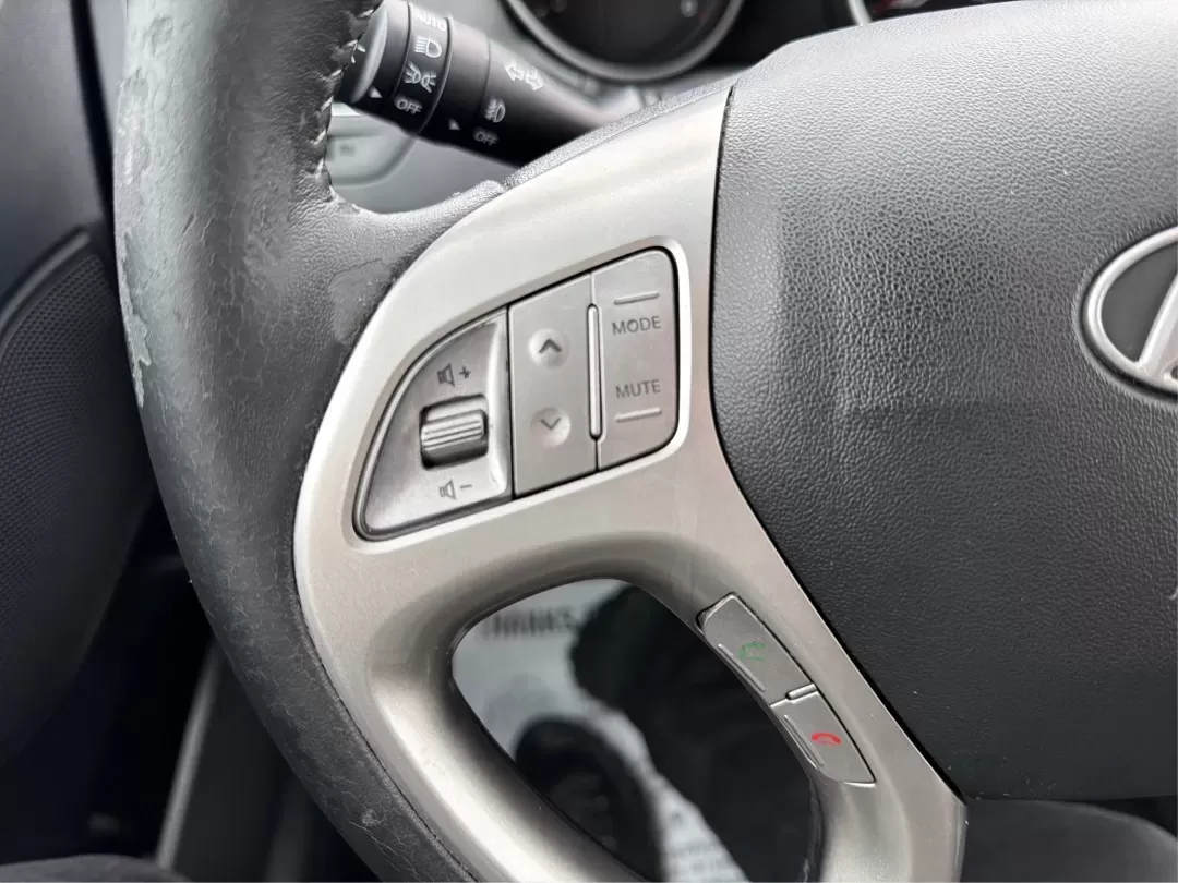 2012 Hyundai Tucson Limited (KM8JU3AC5CU) with an Theta II 2.4L I-4 DOHC engine, 6-Speed Automatic transmission, located at 880 E. National Road, Vandalia, OH, 45377, (937) 908-9800, 39.891918, -84.183594 - Need a dependable SUV that fits real life-school drop-offs, I-75 commuting, and weekend getaways to Taylorsville MetroPark-without the stress of traditional bank rules? This 2012 Hyundai Tucson Limited in Ash Black is a smart, comfortable choice for Vandalia drivers who want a practical daily vehicl - Photo#16